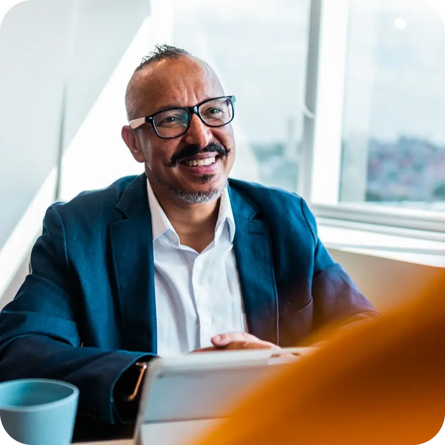 Smiling employer working at a laptop