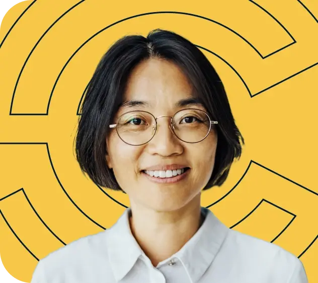 Smiling employer against a yellow Point C backdrop